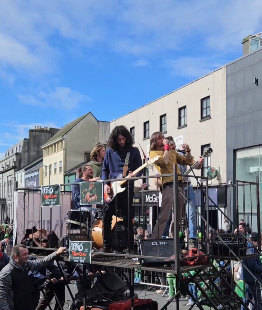 Ol' Times band performing on a float in the St. Patrick's Day parade