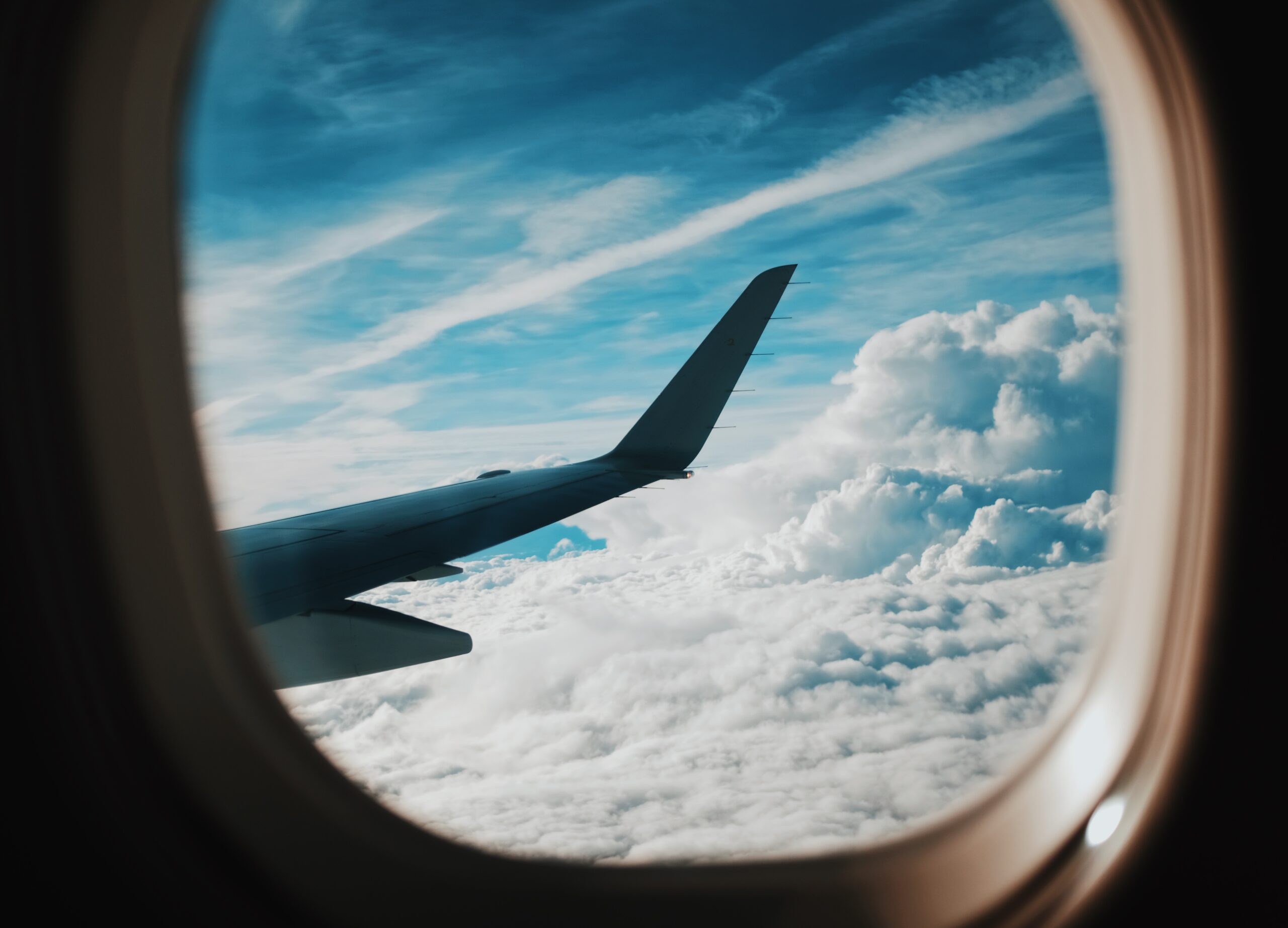 View of airplane and clouds from the window seat