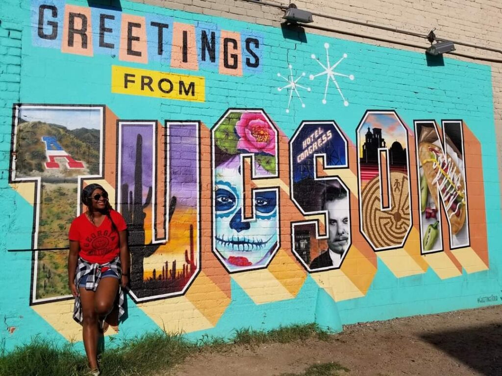 Cross country road trip stop at the Greetings from Tucson mural in Arizona