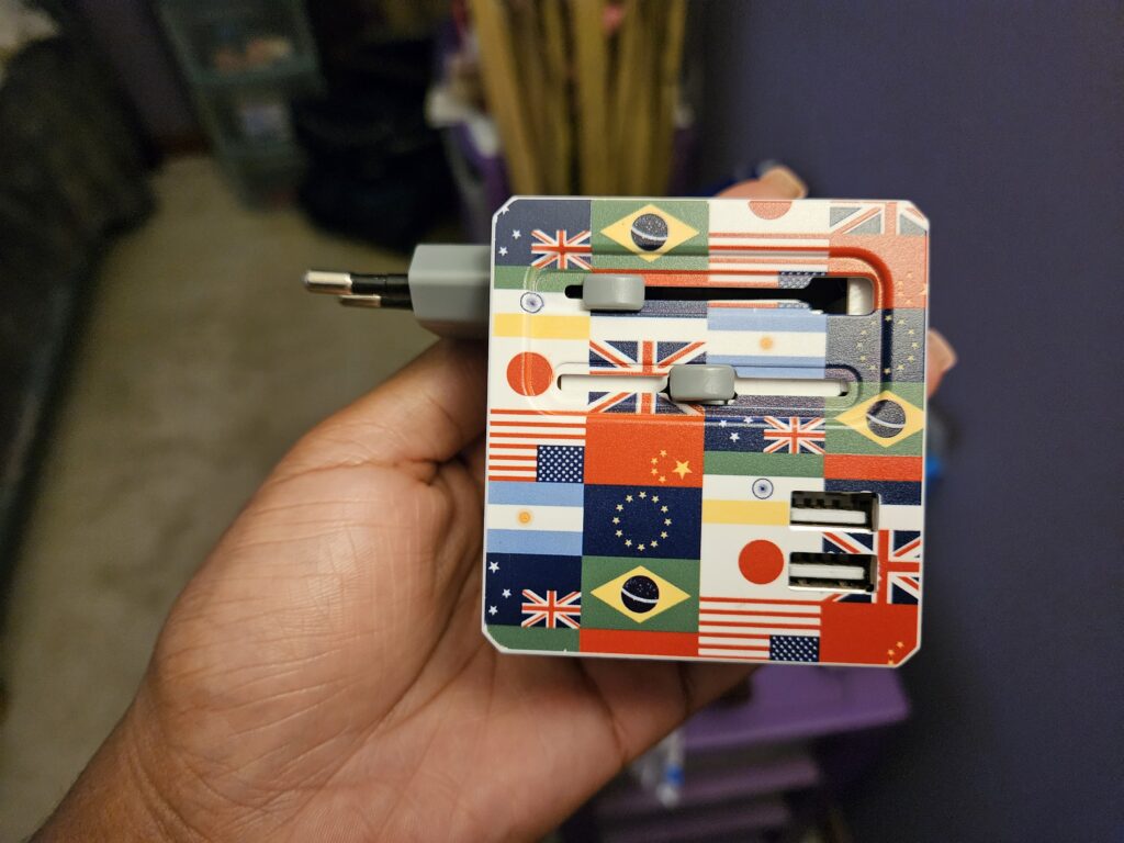 International travel adapter for charging electronics abroad