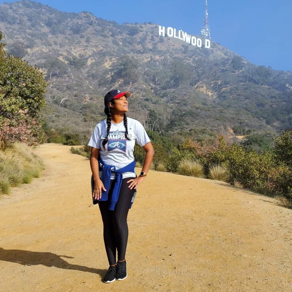 Brittney visiting girls trip destinations like the Hollywood Sign in Los Angeles