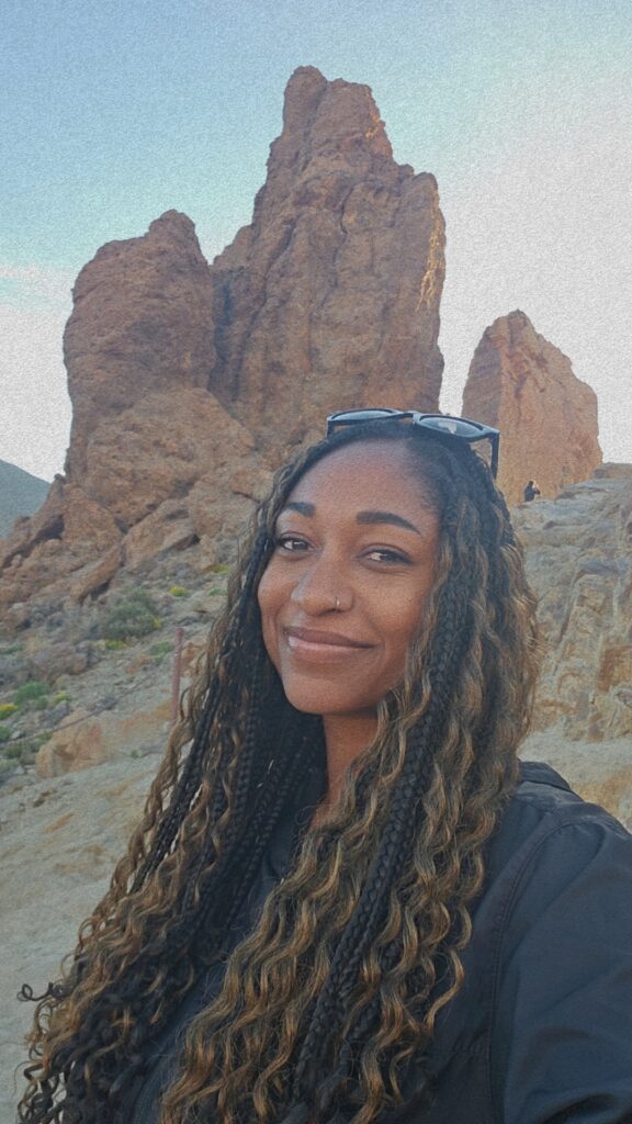 A woman in front of the Mount Teide rock formations