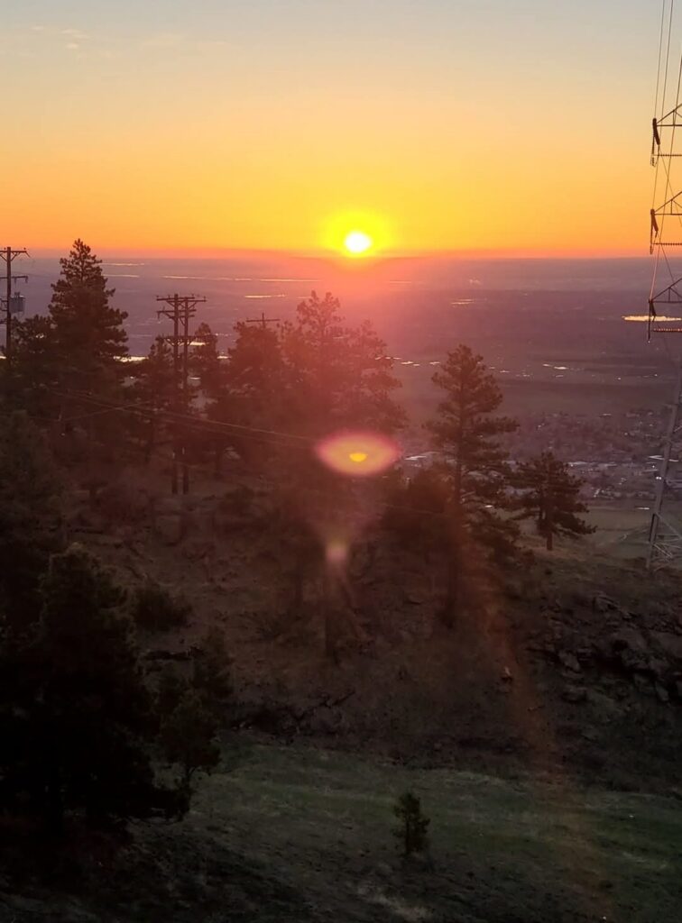 A view of the sunrise over a city in Colorado