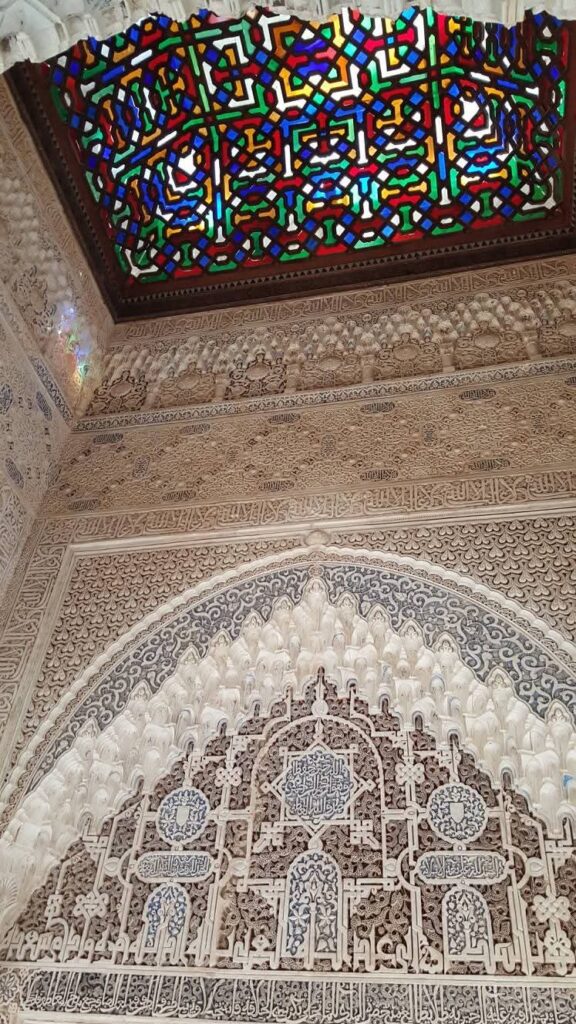 Intricate Islamic architecture inside the Alhambra on my first solo trip to Spain