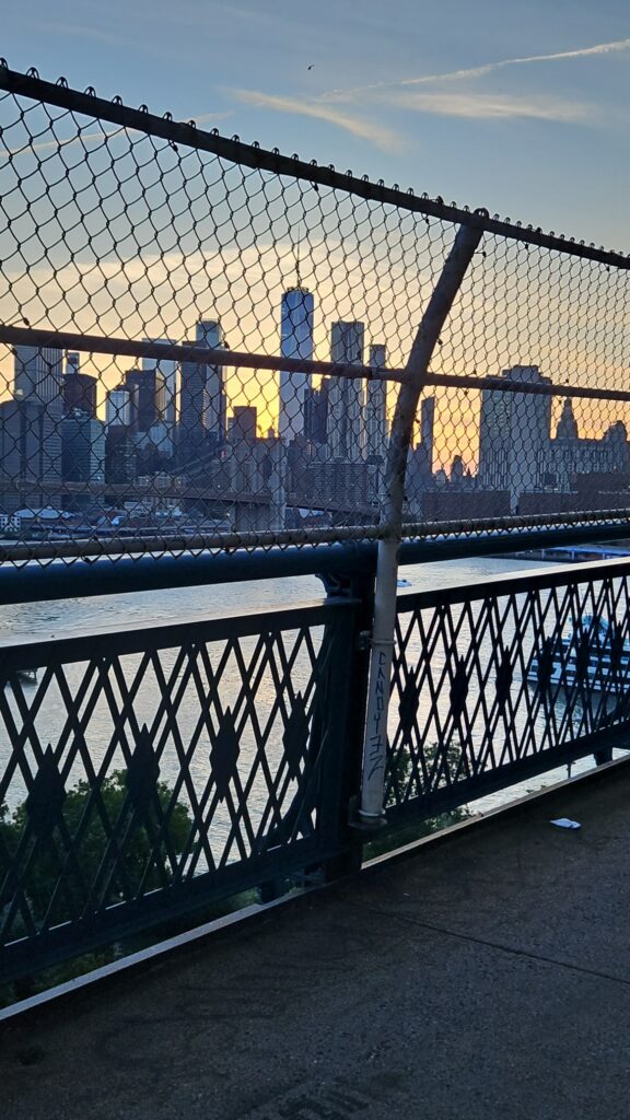 Manhattan Bridge view through chain-link fence
