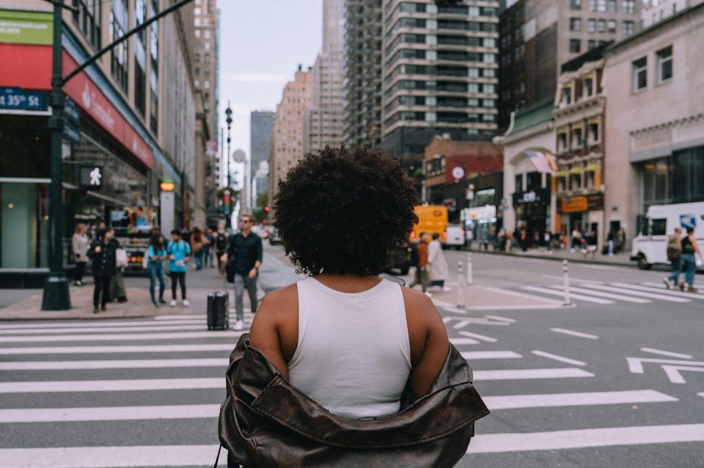 Woman exploring a city alone using solo female travel safety tips